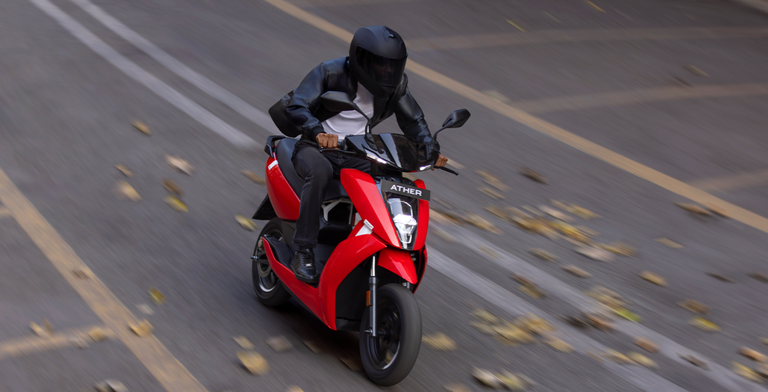 AtherStack Rider on Red Ather Scooter